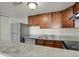 Features stainless steel appliances, light granite countertops, and wooden cabinets at 9725 E Harvard Ave # 305, Denver, CO 80231
