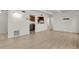Open living room features wood floors and a pass-through to the kitchen area at 9725 E Harvard Ave # 305, Denver, CO 80231