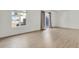 Bright living room has light wood floors, and a sliding glass door that leads to an outdoor balcony at 9725 E Harvard Ave # 305, Denver, CO 80231
