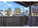 Features a wooden patio deck with a view of a parking lot at 9725 E Harvard Ave # 305, Denver, CO 80231
