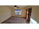 Bedroom with ceiling fan and private access to bathroom at 6567 Pierson St, Arvada, CO 80004