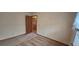 Simple carpeted bedroom with closet and window at 6567 Pierson St, Arvada, CO 80004