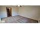 Bright bedroom with carpet and access to a hallway at 6567 Pierson St, Arvada, CO 80004