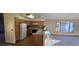 Galley style kitchen with wood cabinets and breakfast bar at 6567 Pierson St, Arvada, CO 80004