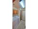 Laundry room with washer, dryer, and cabinets at 6567 Pierson St, Arvada, CO 80004