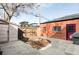 Brick exterior with a small yard, a wooden fence, and a grill, offering a cozy outdoor space at 3641 N Cook St, Denver, CO 80205