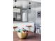 Inviting dining area with stylish decor, a charming bowl, and a glimpse into the modern kitchen space at 3641 N Cook St, Denver, CO 80205