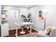 Bright home office with a standing desk, shelves, and natural light at 3641 N Cook St, Denver, CO 80205