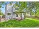 Backyard has a wood deck with pergola and a grassy, fenced yard at 744 Owl Dr, Louisville, CO 80027