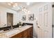 Spacious bathroom featuring double sinks, granite countertops, and bright lighting at 744 Owl Dr, Louisville, CO 80027