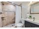 Bathroom with step-in tiled shower, modern fixtures, and vanity at 744 Owl Dr, Louisville, CO 80027