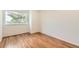 Bright bedroom with hardwood floors and natural light from a large window at 744 Owl Dr, Louisville, CO 80027
