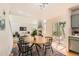 Charming dining area adjacent to the living room and patio, perfect for entertaining guests at 744 Owl Dr, Louisville, CO 80027