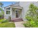 Welcoming front entrance with a covered porch, light gray facade, and well-maintained landscaping at 744 Owl Dr, Louisville, CO 80027