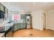 Bright kitchen featuring stainless steel appliances, light gray cabinets, and hardwood floors at 744 Owl Dr, Louisville, CO 80027