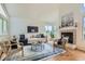 Bright and airy living room with vaulted ceiling, fireplace, and stylish modern furniture at 744 Owl Dr, Louisville, CO 80027
