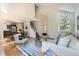 Spacious living room open to dining area, with high ceilings and abundant natural light at 744 Owl Dr, Louisville, CO 80027
