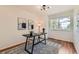Charming office space with natural light, art, and a decorative rug at 744 Owl Dr, Louisville, CO 80027