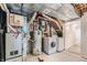 The utility room has a furnace, water heater, and washer/dryer at 744 Owl Dr, Louisville, CO 80027