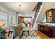 Bright dining area adjacent to the living room with staircase and dining table at 3233 W 29Th Ave, Denver, CO 80211