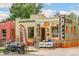 Cafe Zuri exterior featuring outdoor seating, artistic signage, and a welcoming storefront at 3233 W 29Th Ave, Denver, CO 80211