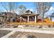 Charming single-Gathering home featuring a cozy front porch and a well-maintained lawn with a decorative fence at 3233 W 29Th Ave, Denver, CO 80211