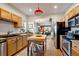 Open kitchen with stainless appliances and a view into the living area at 3233 W 29Th Ave, Denver, CO 80211