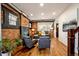 Inviting living room showcasing exposed brick, hardwood floors, and contemporary furnishings for a stylish aesthetic at 3233 W 29Th Ave, Denver, CO 80211