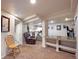 Inviting living room area with an adjacent kitchenette, complemented by plush seating and an open layout for entertaining at 3233 W 29Th Ave, Denver, CO 80211