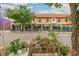 Street view of commercial buildings with Novo Coffee and Metalmark, featuring landscaped planters at 3233 W 29Th Ave, Denver, CO 80211