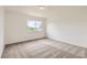A carpeted bedroom that features natural light and minimal features at 3853 Orleans Ct, Denver, CO 80249