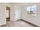 This bedroom features a double door closet, neutral carpet, and ample natural light at 3853 Orleans Ct, Denver, CO 80249