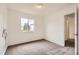 Bright bedroom features a window, neutral walls and carpet at 3853 Orleans Ct, Denver, CO 80249