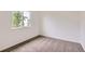 Carpeted bedroom features a window and neutral walls, providing a calming atmosphere at 3853 Orleans Ct, Denver, CO 80249