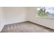This bedroom has neutral carpeting, double-paned windows, and ample natural light at 3853 Orleans Ct, Denver, CO 80249