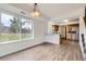 Bright dining area adjacent to kitchen, features hardwood floors and large window at 3853 Orleans Ct, Denver, CO 80249