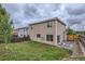 Back exterior shows the yard, patio, and siding at 3853 Orleans Ct, Denver, CO 80249