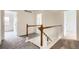 Upstairs hallway shows neutral carpet and paint at 3853 Orleans Ct, Denver, CO 80249