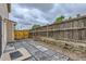 Paver patio features a wood fence at 3853 Orleans Ct, Denver, CO 80249