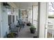 Relaxing front porch with comfortable seating and decorative potted plants at 7472 E 28Th Ave, Denver, CO 80238