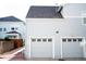 Attached garage with a two-car setup featuring a modern design and ample space at 7472 E 28Th Ave, Denver, CO 80238