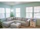 Cozy living room featuring a large sectional sofa and natural light at 7472 E 28Th Ave, Denver, CO 80238