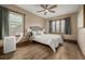 Bedroom with hardwood floors, a ceiling fan, and natural light from dual windows at 1138 E 14Th Ave # 12, Denver, CO 80218