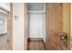 Open closet with wooden frame, white walls and hardwood floor; electrical outlet on the adjacent wall at 1138 E 14Th Ave # 12, Denver, CO 80218