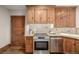 Updated kitchen features stainless steel appliances, tile backsplash, granite counters, and wooden cabinets at 1138 E 14Th Ave # 12, Denver, CO 80218