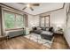 Comfortable living room with hardwood floors, stylish seating, and natural light at 1138 E 14Th Ave # 12, Denver, CO 80218