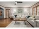 Bright living room featuring hardwood floors, a ceiling fan, and neutral décor with light-filled space at 1138 E 14Th Ave # 12, Denver, CO 80218