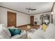 Bright living room with hardwood floors, a ceiling fan, and stylish decor, showcasing a comfortable space at 1138 E 14Th Ave # 12, Denver, CO 80218