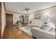 Cozy living room featuring hardwood floors, natural light, a ceiling fan, and stylish decor throughout the space at 1138 E 14Th Ave # 12, Denver, CO 80218