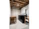 Unfinished basement laundry area with washer and dryer at 4395 E Jewell Ave # 3, Denver, CO 80222
